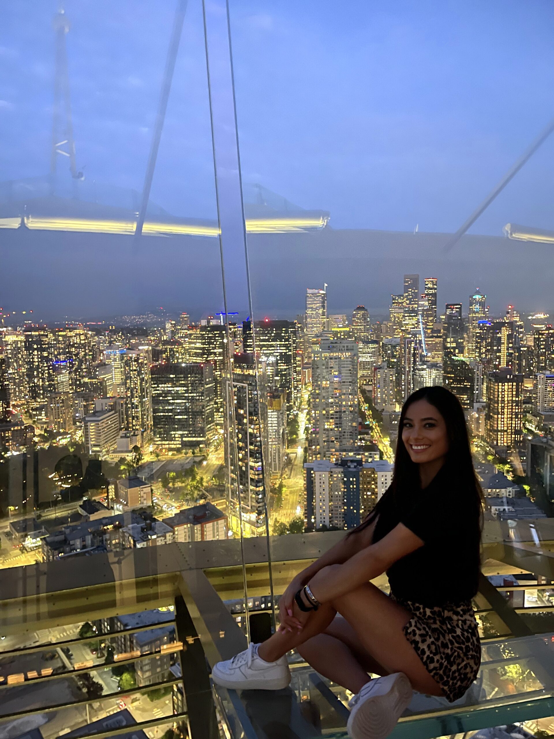 girl with Seattle skyline in the background 